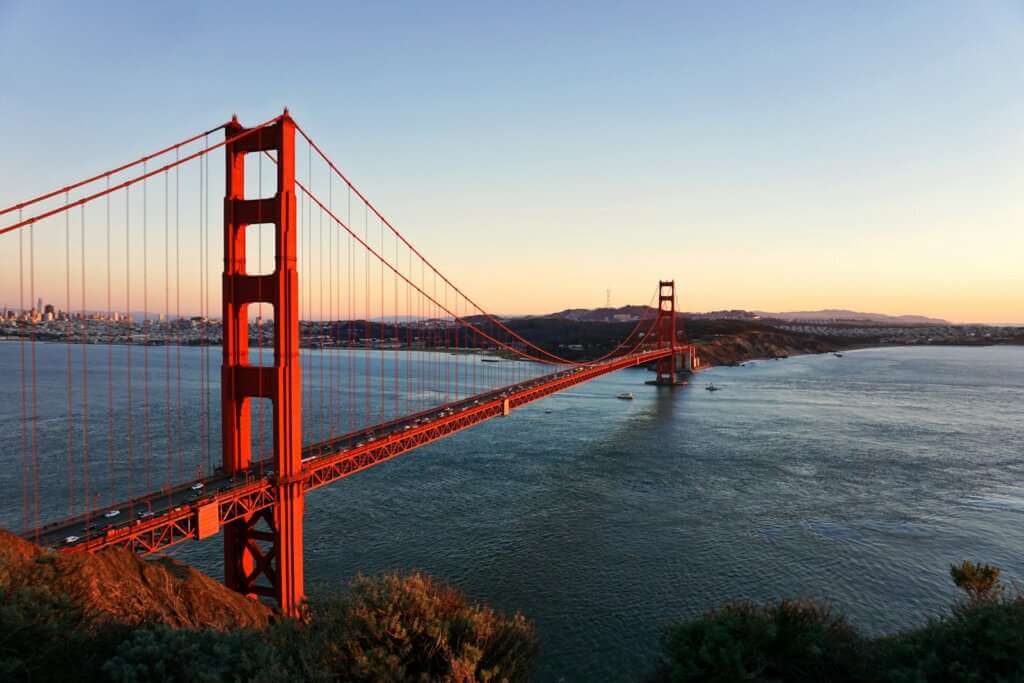 Sunset view of the Golden Gate Bridge near Alameda real estate market