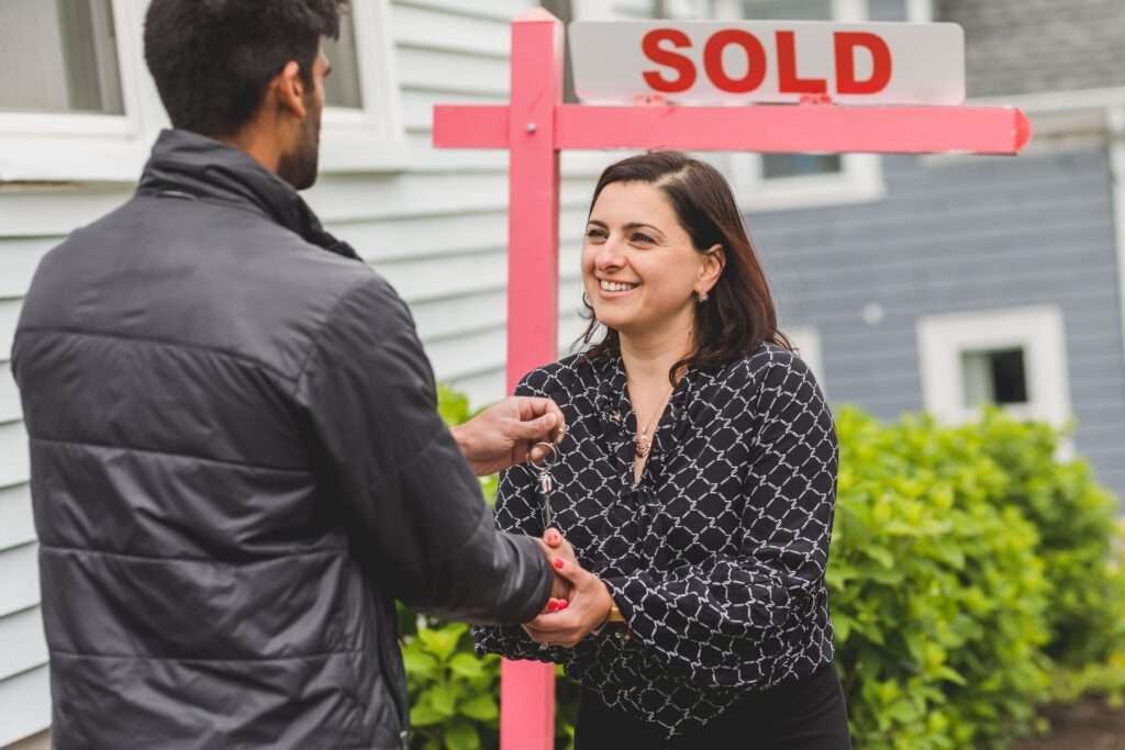First-time buyers can avoid overpaying by comparing mortgage offers, reviewing closing costs, and negotiating beyond the purchase price. First-time homebuyer reviewing mortgage costs and offer strategy before buying a home